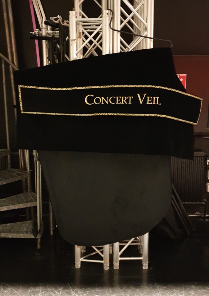 The Concert Veil hanging on its hanger